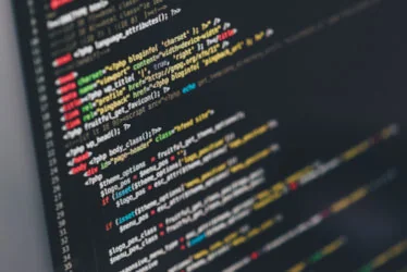 Website code shown on a computer screen